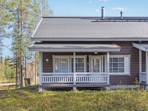 A two-story house with a porch, a chimney, and a number '2' on the side.