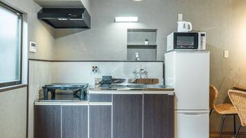 Comfort Villa | Private kitchen | Fridge, microwave, stovetop, electric kettle