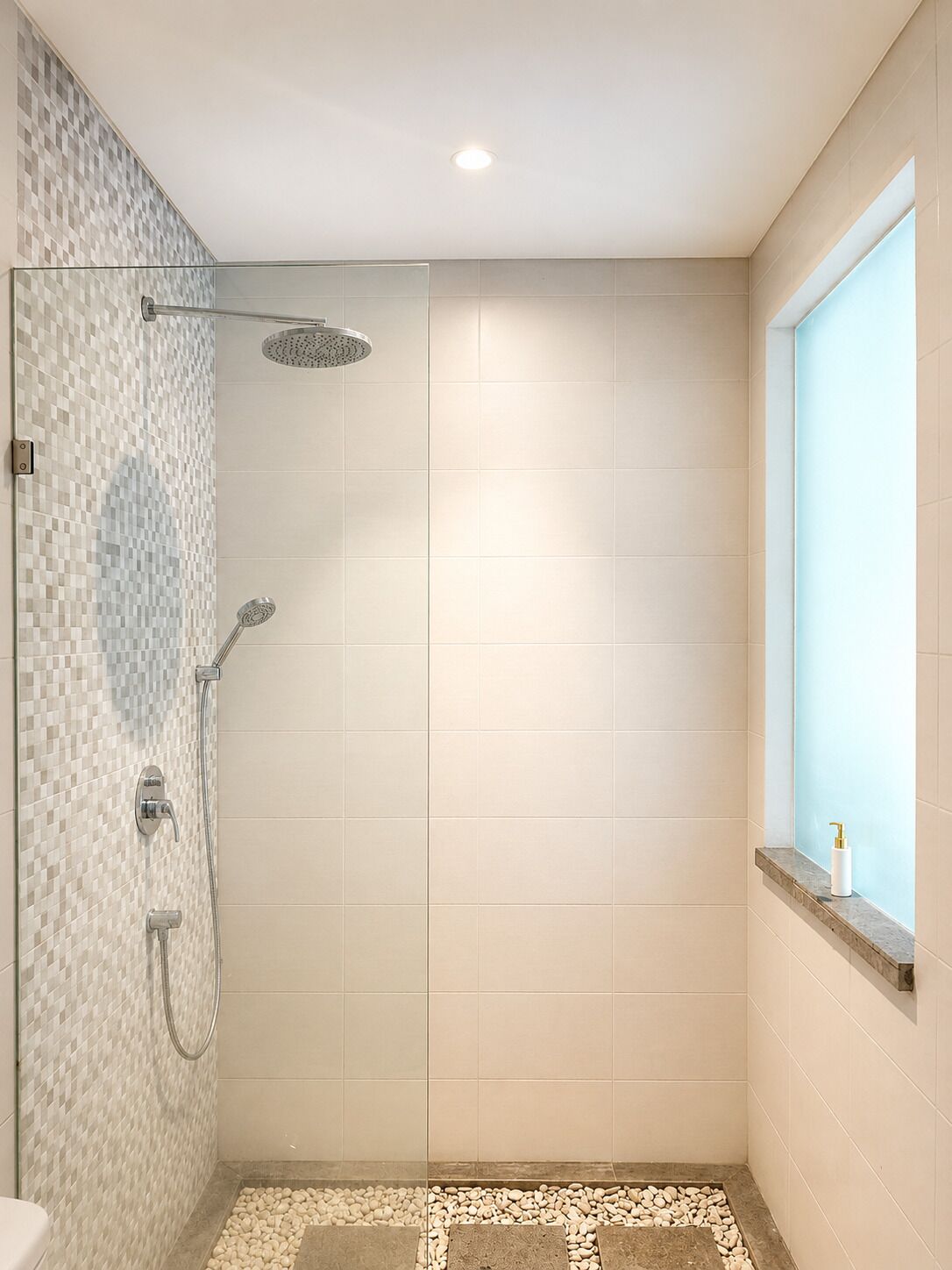A shower with a glass door, a tiled floor, and a window with a view.
