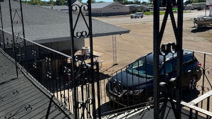 A parking lot with a building labeled "Pioneer Museum" in the background.