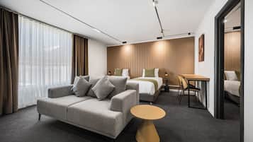 Queen Family Suite | 1 bedroom, pillowtop beds, in-room safe, individually furnished