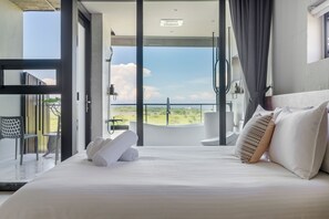 A modern bedroom with a large bed, a view of the outdoors, and a balcony. - Ningxialight (Wujie)