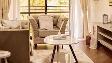 Deluxe Apartment, City View | Living area | Flat-screen TV