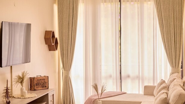 Apartment, Hill View | Living area | TV - Sand Grains Residences 002 (Entebbe)