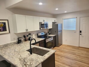 Microwave, oven, stovetop, dishwasher - "Two-Story Townhome Newly Renovated One-Bedroom Getaway Awaits Your Stay!" (Tucson)