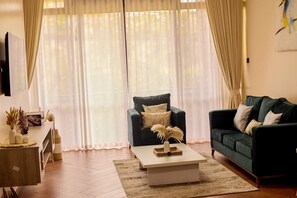 Classic Apartment, Hill View | Living area - Sand Grains Residences 003 (Entebbe)