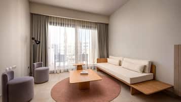 Executive Room Pool View | Living area | 55-inch TV with cable channels