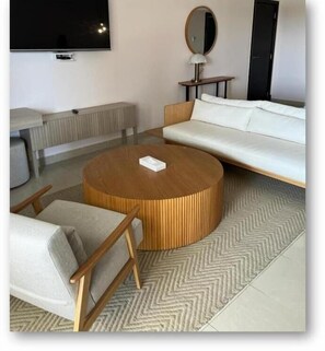 Junior Suite Golf View | Living area | 55-inch Smart TV with cable channels