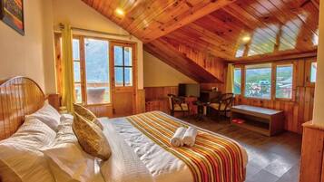 Premium bedding, pillow-top beds, desk, laptop workspace