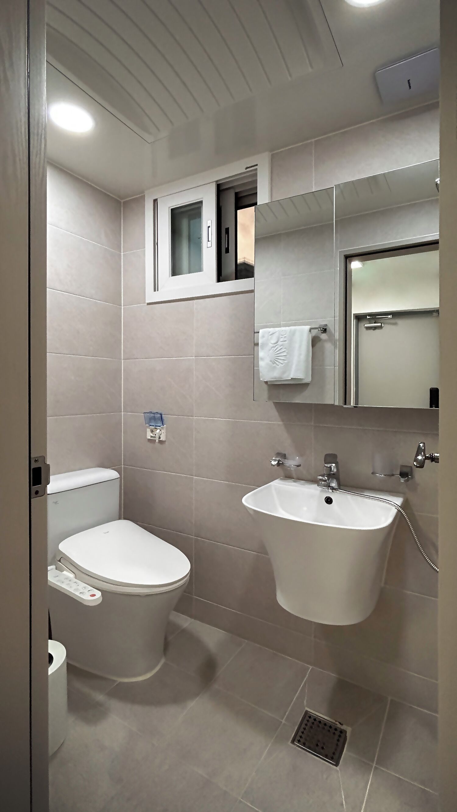 Shower, hair dryer, slippers, towels