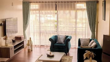 Luxury Apartment, Hill View | Living area | TV