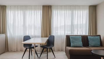 Luxury Double Room, City View | Living area | 32-inch LED TV with cable channels