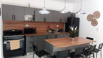 Villa | Private kitchen | Fridge, microwave, oven, stovetop