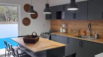 Villa | Private kitchen | Fridge, microwave, oven, stovetop