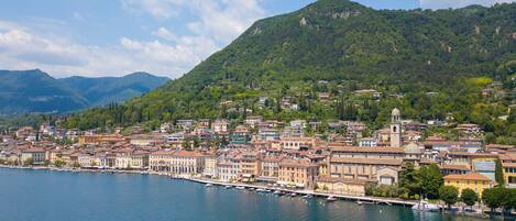 A coastal town with a marina, historic buildings, and a prominent church.