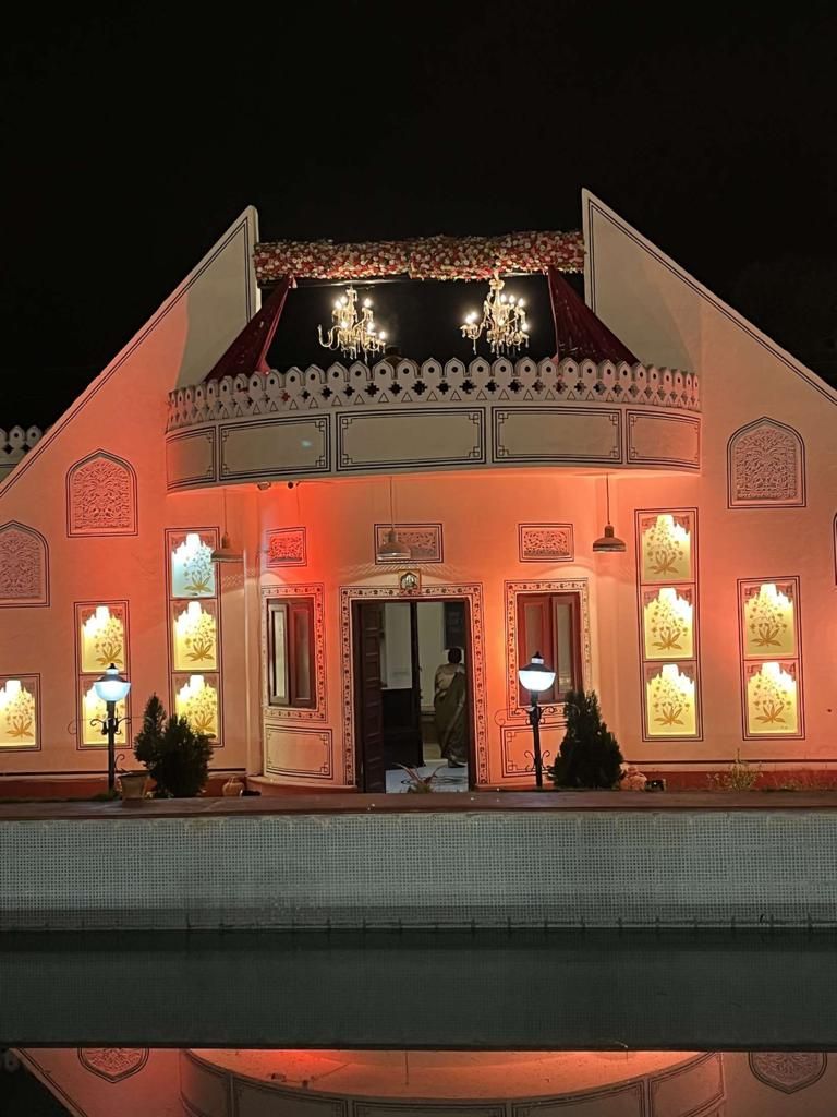 A building with a traditional architectural style, featuring ornate decorations and a central entrance.