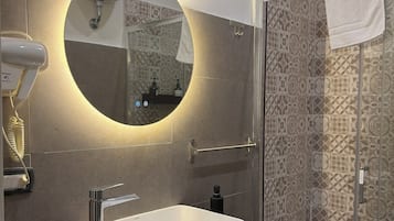 Shower, hair dryer, bathrobes, towels