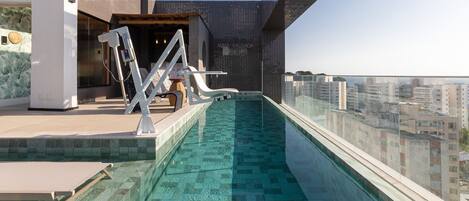 Indoor pool, open 9:00 AM to 9:00 PM, pool umbrellas, sun loungers