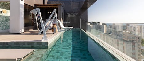 Indoor pool, open 9:00 AM to 9:00 PM, pool umbrellas, sun loungers