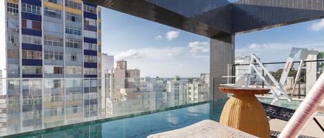 Indoor pool, open 9:00 AM to 9:00 PM, pool umbrellas, sun loungers