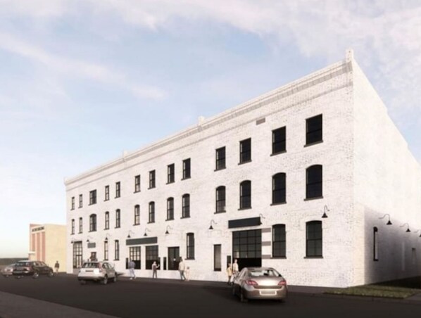 A white building with multiple windows and a flat roof. - The Safe House Downtown Newport News (Newport News)