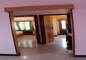 Family Room, Balcony | Living room | 40-inch Smart TV with cable channels - Lingaa's Archana Homestay (Tiruvannamalai)