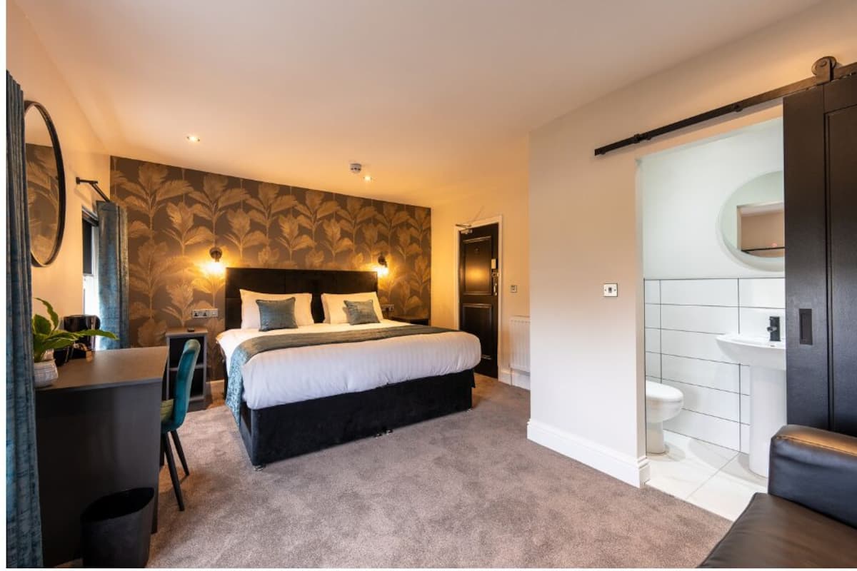 Habitación cuádruple Deluxe, varias camas | Wifi gratis