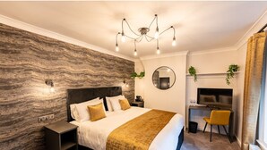 A modern bedroom with a large bed, a desk, and a TV. - Home at 42 Arkles Lane (Liverpool)