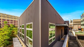A modern building with large windows and a flat roof. - Tracyton Condo 202 in Bremerton (Bremerton)