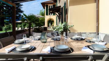 Enjoy a casual meal in our outdoor dining area with a view of the landscaped garden.