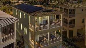 A multi-story residential building with a rooftop pool and balconies. - Bayview Pointe! Luxury Villa near Anna Maria Island with Saltwater Heated Pool! (Cortez)