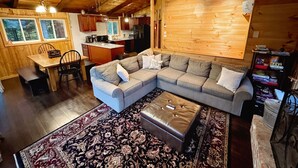 A cozy cabin interior with a living room, dining area, and kitchen. - Pet Friendly Ski House, Game Rm, 4 Mins to Mt Snow (Dover)