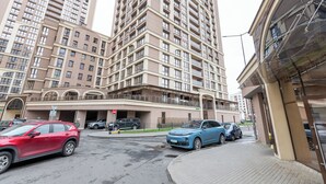 A multi-story residential building with a modern architectural design, featuring balconies and large windows. - Apartments in the complex Vogue (Minsk)