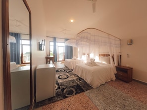 Deluxe Triple Room, Sea View | In-room safe, individually decorated, individually furnished, desk