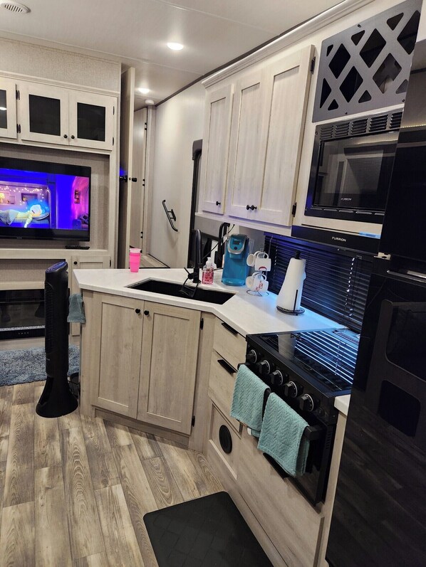 Private kitchen - Cozy 2-bedroom RV in charming Kemah with WiFi, AC (Kemah)