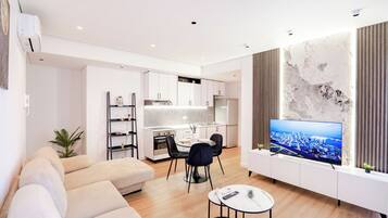 Deluxe Apartment | Living area | 42-inch Smart TV with satellite channels