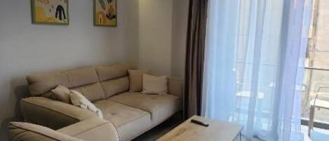 Apartment, 1 Bedroom, Balcony | Living area | 42-inch Smart TV with satellite channels