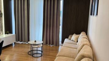 Apartment, 1 Bedroom, Balcony | Living area | 42-inch Smart TV with satellite channels