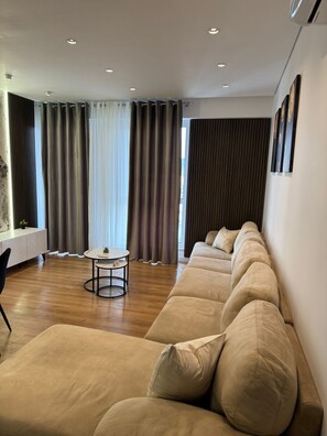 Apartment, 1 Bedroom, Balcony | Living area | 42-inch Smart TV with satellite channels