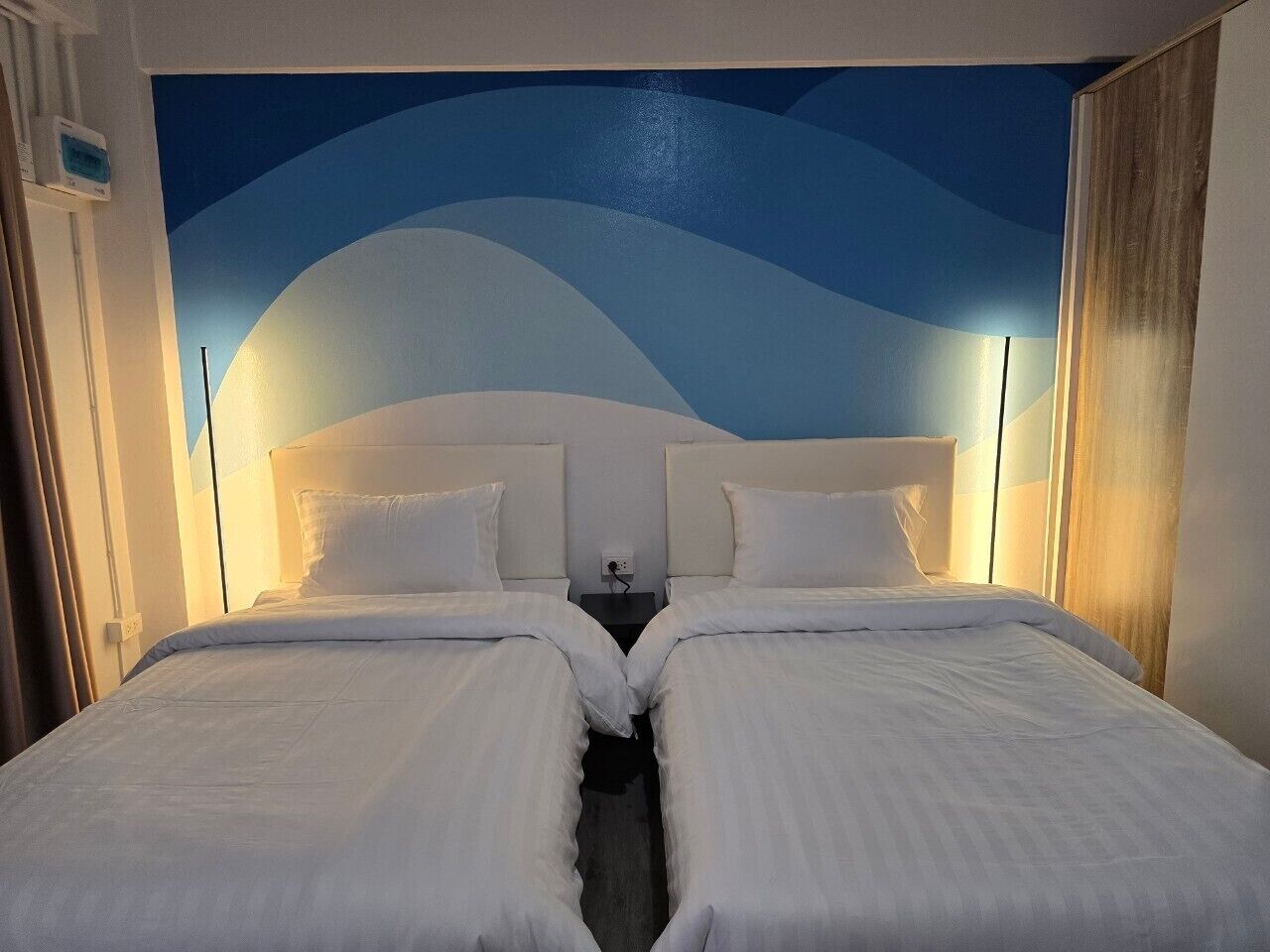 Laptop workspace, bed sheets