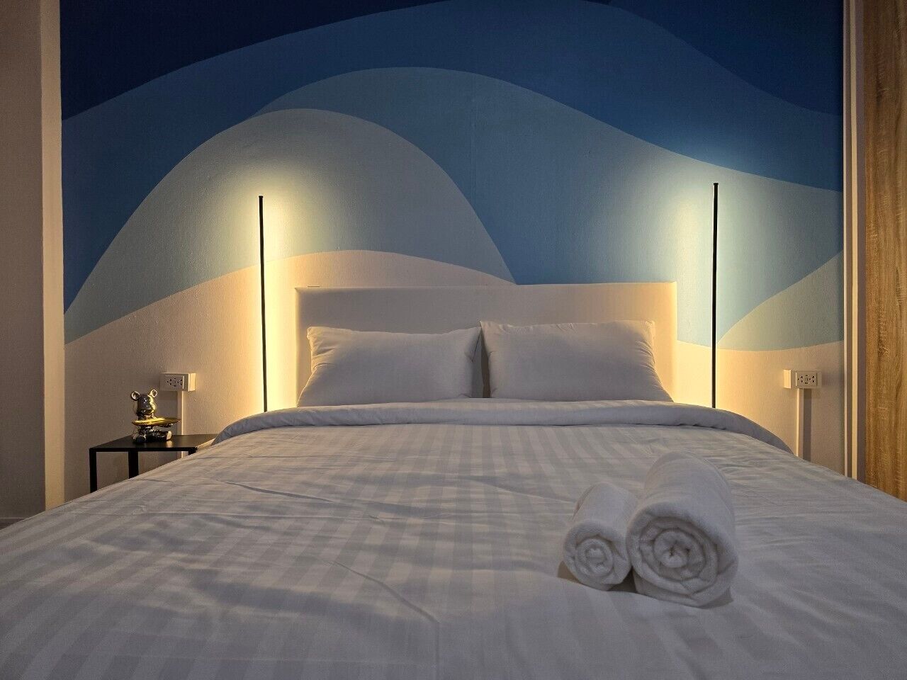 Laptop workspace, bed sheets