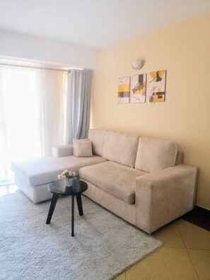 Comfort Apartment, City View | Living area | 24-inch Smart TV with digital channels - Lux Suites Makao Rossyln Apartments (Nairobi)