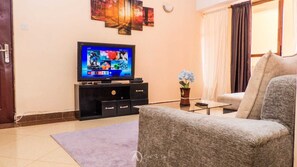 Comfort Apartment, City View | Living area | 24-inch Smart TV with digital channels - Lux Suites Makao Rossyln Apartments (Nairobi)