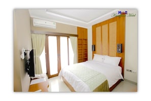 Habitación estándar, 1 cama Queen size | Escritorio, cortinas blackout, insonorización y wifi gratis