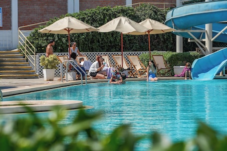 2 outdoor pools, pool umbrellas, lifeguards on site