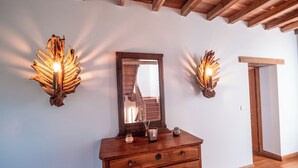 A wooden dresser with a mirror and two wall sconces. - Casa Lounell Swimming pool-SPA-Sauna-Games room, panoramic view   (Graulhet)