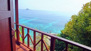A wooden balcony with a view of the ocean and a distant island. - Peaceful Seaview Bungalow Koh Tao Snorkeling and Relaxing Paradise Sharkbay (Koh Tao)