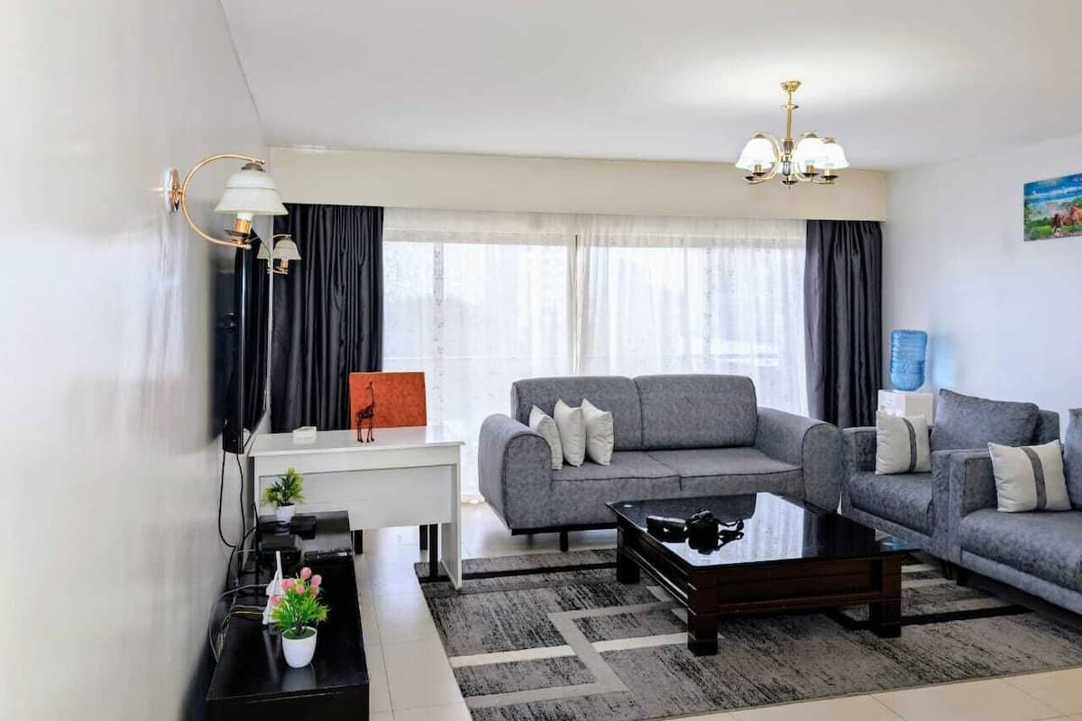 Family Apartment, Balcony | Living area | 24-inch Smart TV with digital channels