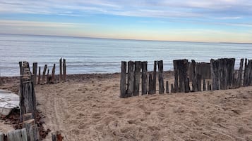 On the beach, sun loungers, beach towels
