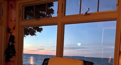 Beachfront lake house with large deck, beach bonfire & stunning views!